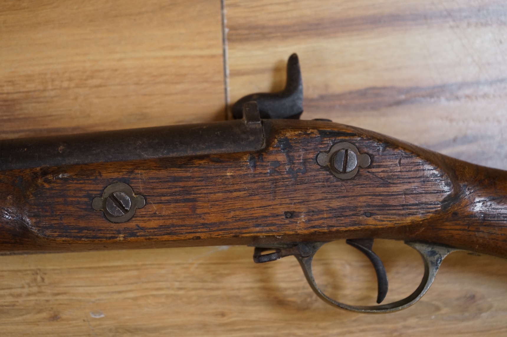 An Indian military style percussion musket, fully stocked, barrel 115cm, with military style brass mounts, iron barrel bands and Enfield style lock, partly 19th century